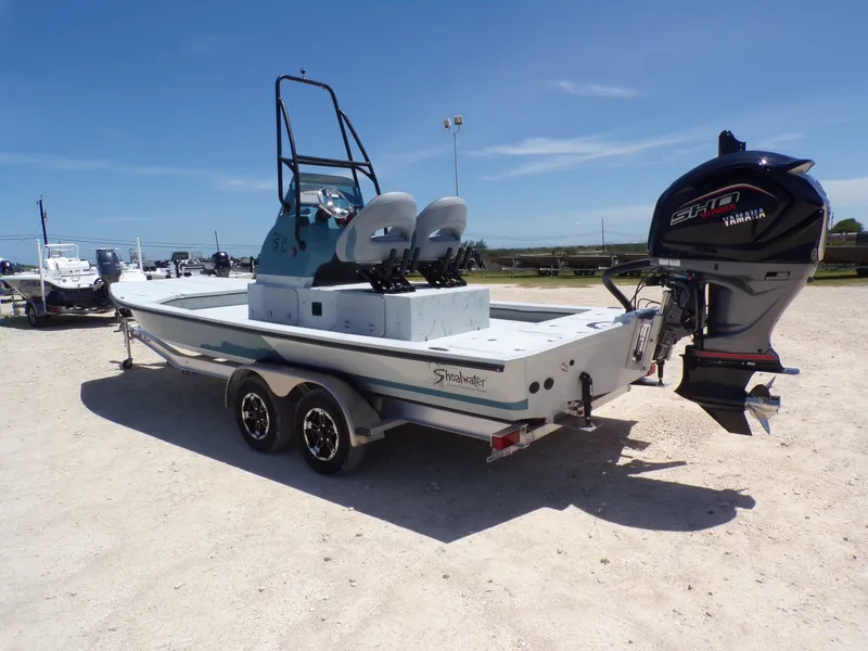 Slide: The Image of 2025 Shoalwater 23' Catamaran with Yamaha outboard motor. - 12