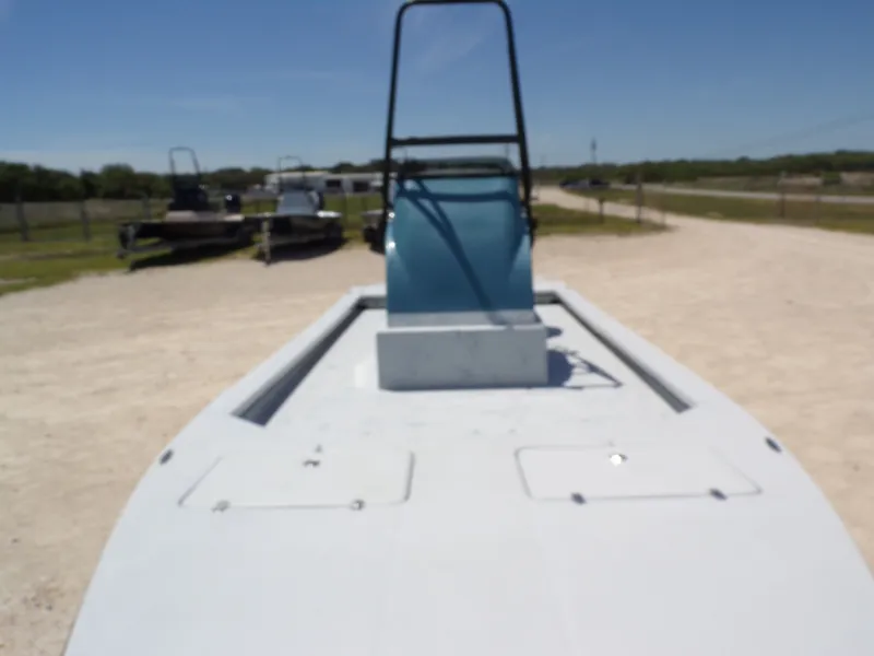 Slide: The Image of 2025 Shoalwater 23' Catamaran on a gravel lot. - 13