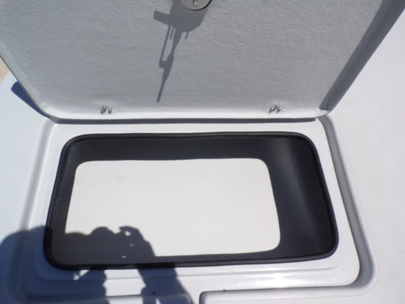 Slide: The Image of Open storage hatch on Shoalwater 23' Catamaran 2025. - 19