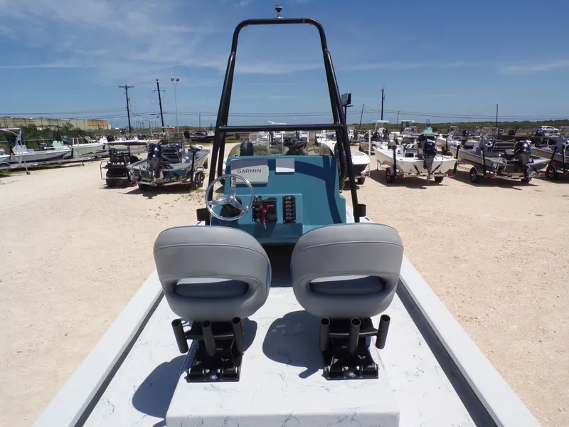 Slide: The Image of Interior view of a 2025 Shoalwater 23' Catamaran with dual seats. - 21