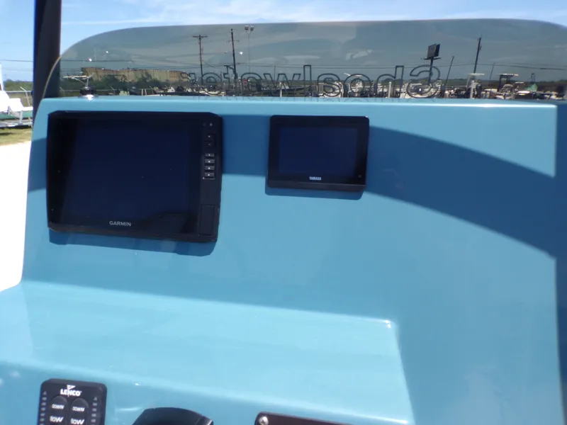 Slide: The Image of Dashboard of a 2025 Shoalwater 23' Catamaran with Garmin display. - 25