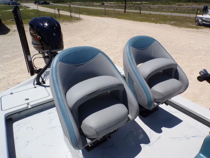 Slide: The Image of 2025 Shoalwater 23' Catamaran with gray and blue seats. - 28