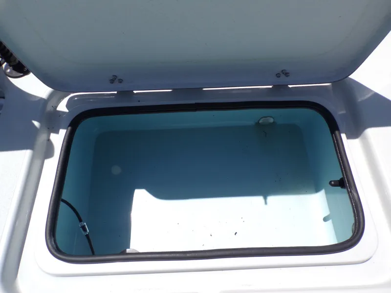 Slide: The Image of Open storage compartment on a 2025 Shoalwater 23' Catamaran. - 33