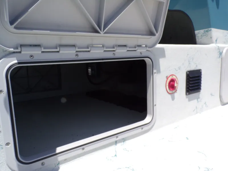 Slide: The Image of Open storage compartment on a 2025 Shoalwater 23' Catamaran. - 36