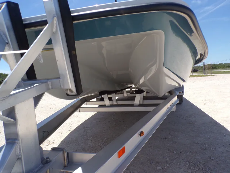 Slide: The Image of 2025 Shoalwater 23' Catamaran on trailer, side view. - 6