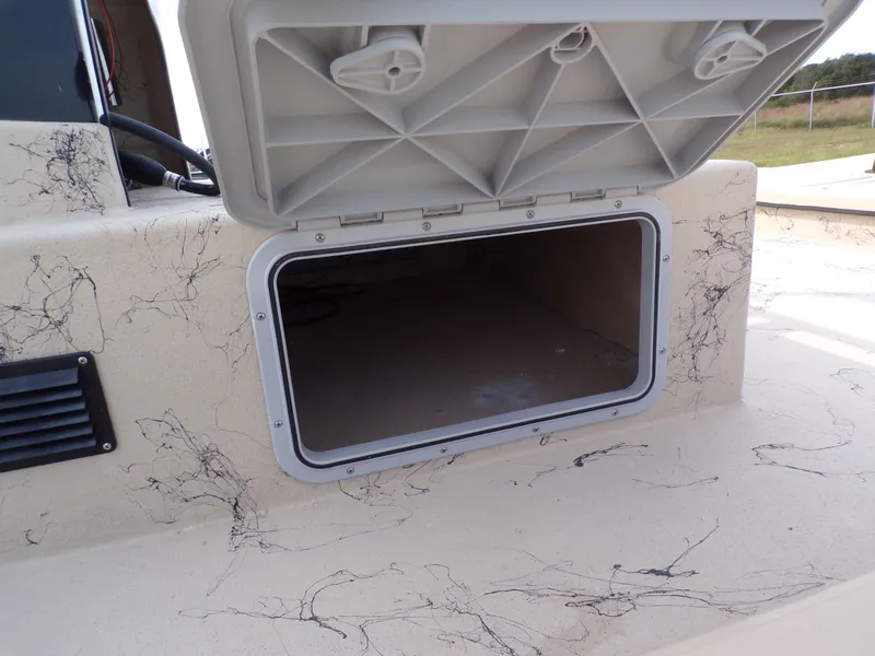 Slide: The Image of Open storage compartment on a 2026 Shoalwater 23' Catamaran. - 12