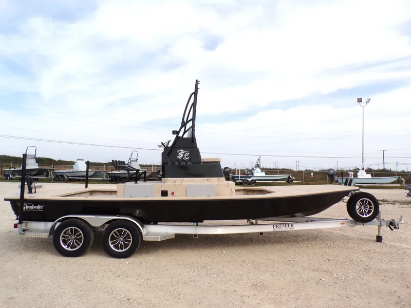 Slide: The Image of 2026 Shoalwater 23' Catamaran on trailer outdoors. - 17