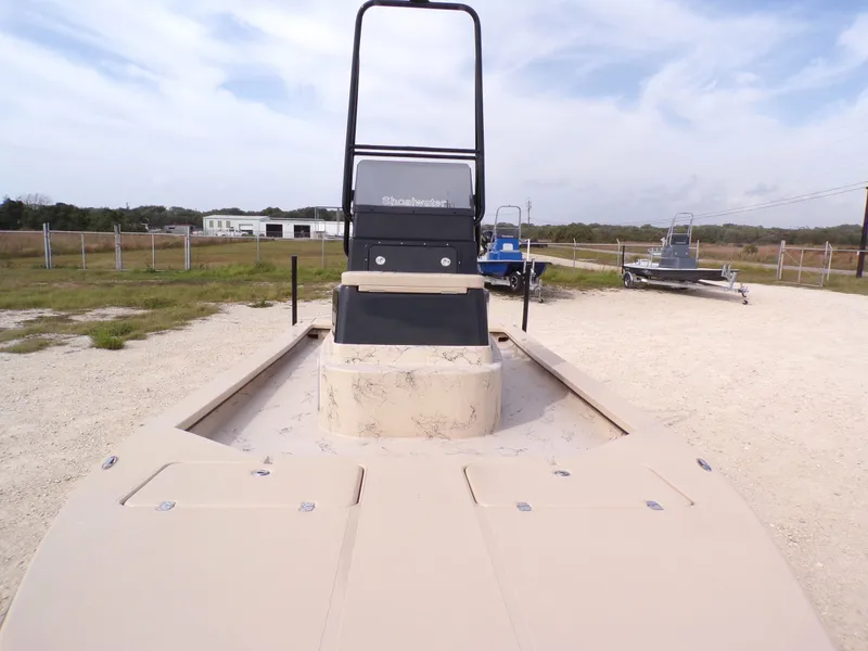 Slide: The Image of 2026 Shoalwater 23' Catamaran parked on gravel lot. - 22