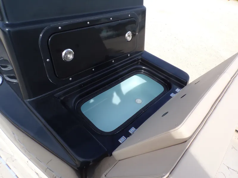 Slide: The Image of Shoalwater 23' Catamaran 2026 with open storage compartment. - 23