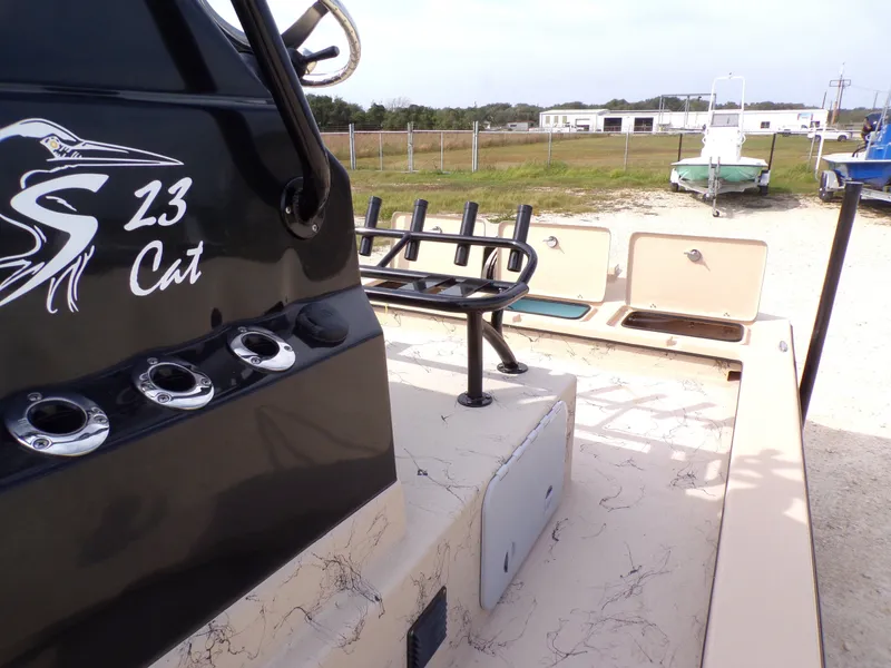Slide: The Image of Shoalwater 23' Catamaran 2026 with rod holders and storage compartments. - 25