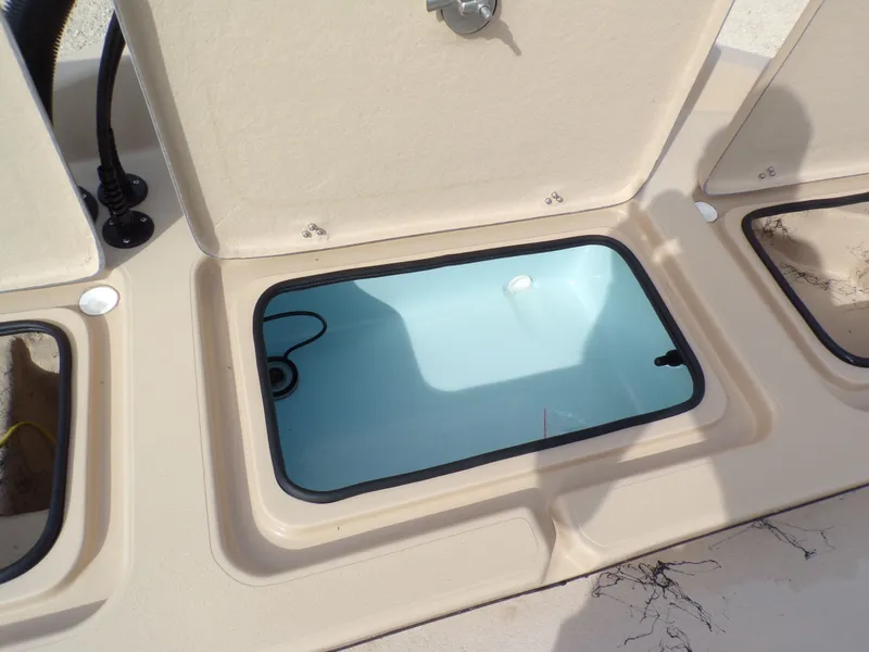 Slide: The Image of Open storage compartment on a 2026 Shoalwater 23' Catamaran. - 26