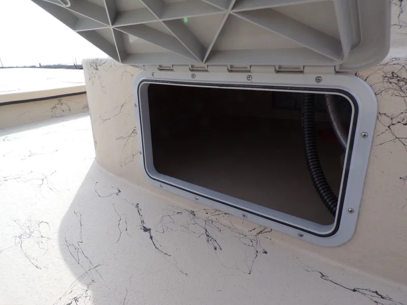 Slide: The Image of Open storage compartment on a 2026 Shoalwater 23' Catamaran. - 34