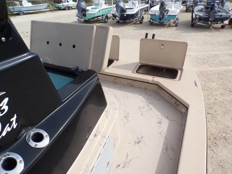 Slide: The Image of 2026 Shoalwater 23' Catamaran with open storage compartments on deck. - 6