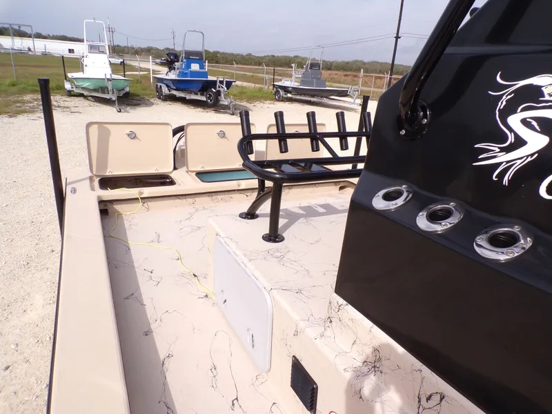 Slide: The Image of 2026 Shoalwater 23' Catamaran with rod holders and storage compartments. - 8
