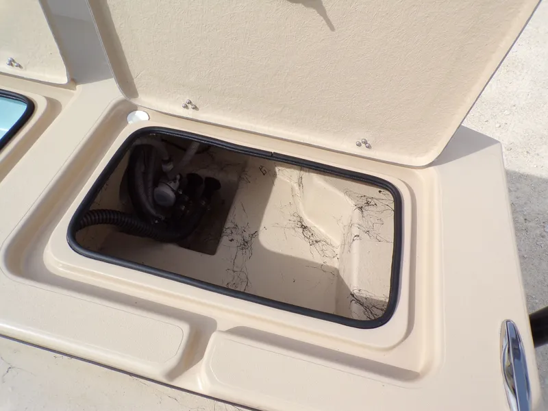 Slide: The Image of Open storage compartment of a 2026 Shoalwater 23' Catamaran. - 9