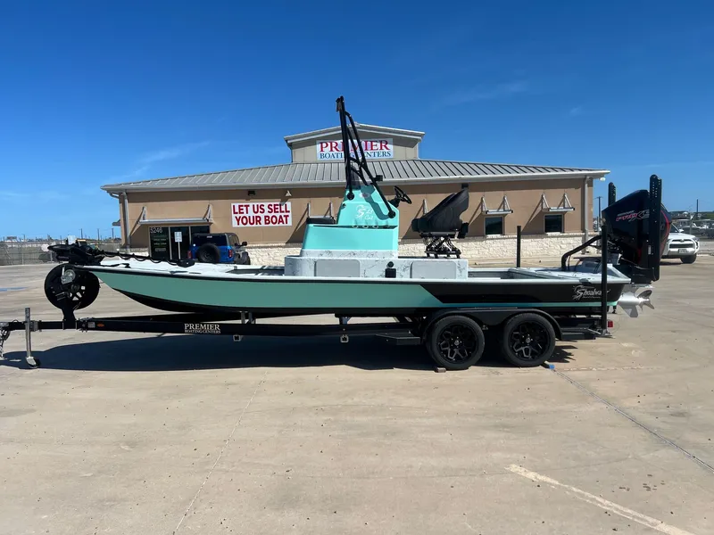 The Image of 2026 Shoalwater 23' Catamaran in front of boat sales center. - 1