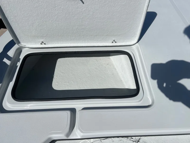 Slide: The Image of Open storage compartment on a 2026 Shoalwater 23' Catamaran. - 17