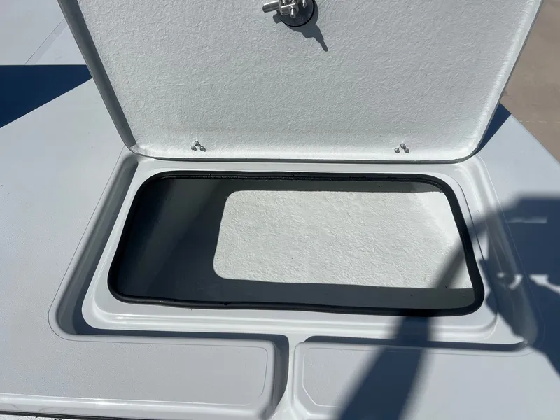 Slide: The Image of Open storage compartment on a 2026 Shoalwater 23' Catamaran. - 18