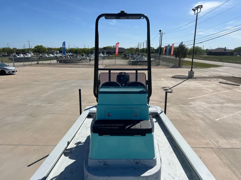 Slide: The Image of 2026 Shoalwater 23' Catamaran on a sunny parking lot. - 19