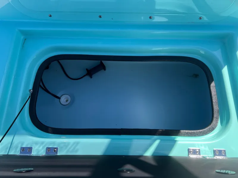 Slide: The Image of Interior view of a Shoalwater 23' Catamaran storage compartment, 2026 model. - 22