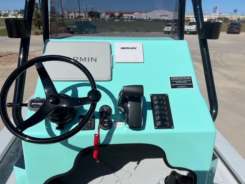 Slide: The Image of Control console of a 2026 Shoalwater 23' Catamaran. - 24