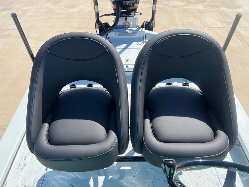 Slide: The Image of Two black seats on a 2026 Shoalwater 23' Catamaran. - 25
