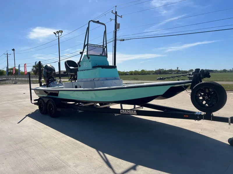 Slide: The Image of 2026 Shoalwater 23' Catamaran on trailer outdoors. - 6
