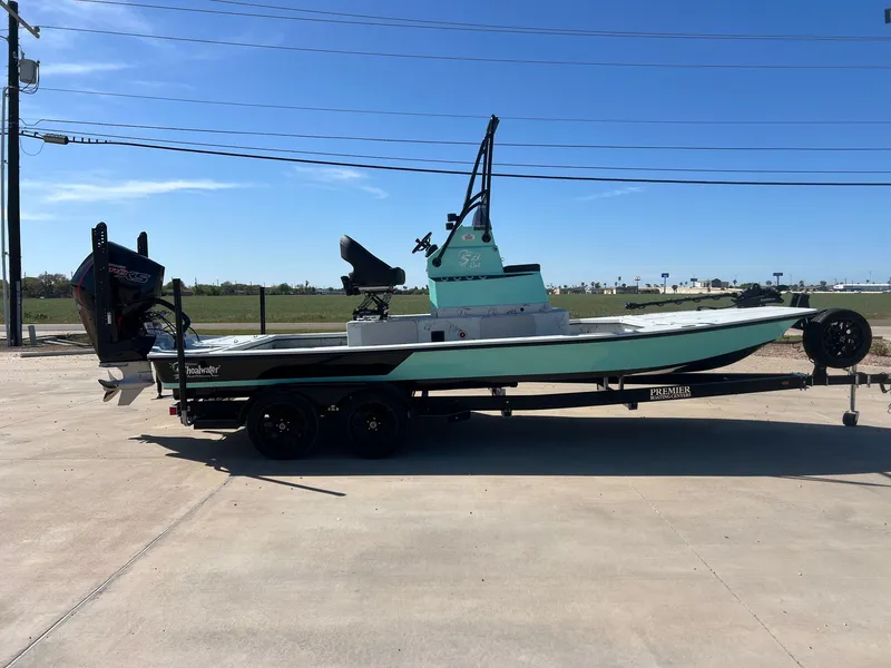 Slide: The Image of 2026 Shoalwater 23' Catamaran on trailer outdoors. - 7