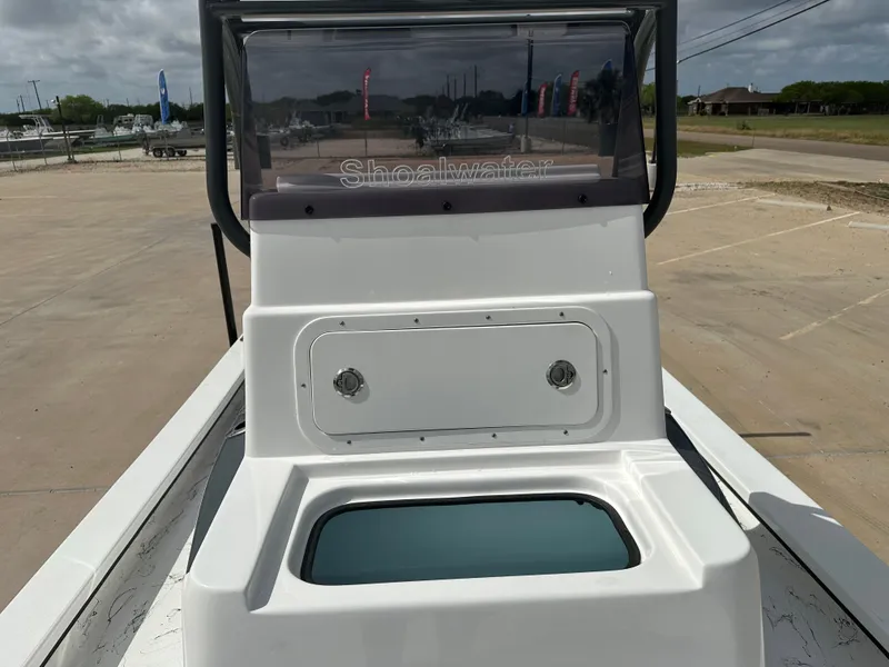 Slide: The Image of 2026 Shoalwater 23' Catamaran with storage compartment and windshield. - 12