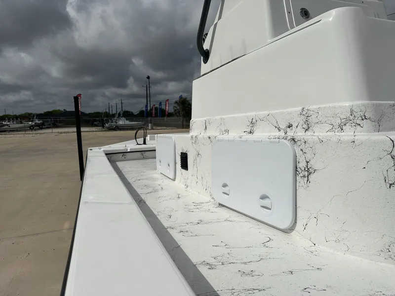 Slide: The Image of 2026 Shoalwater 23' Catamaran featuring sleek design and storage compartments. - 17