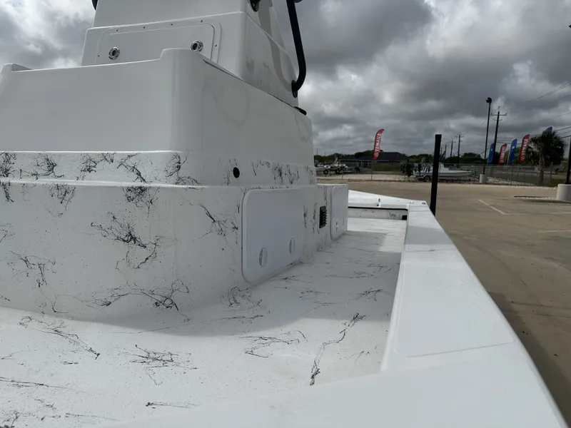 Slide: The Image of 2026 Shoalwater 23' Catamaran with sleek design under cloudy sky. - 18
