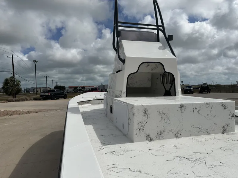 Slide: The Image of 2026 Shoalwater 23' Catamaran on a parking lot under cloudy skies. - 19