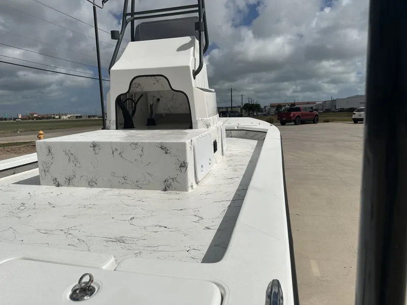 Slide: The Image of 2026 Shoalwater 23' Catamaran with sleek design on parking lot. - 20