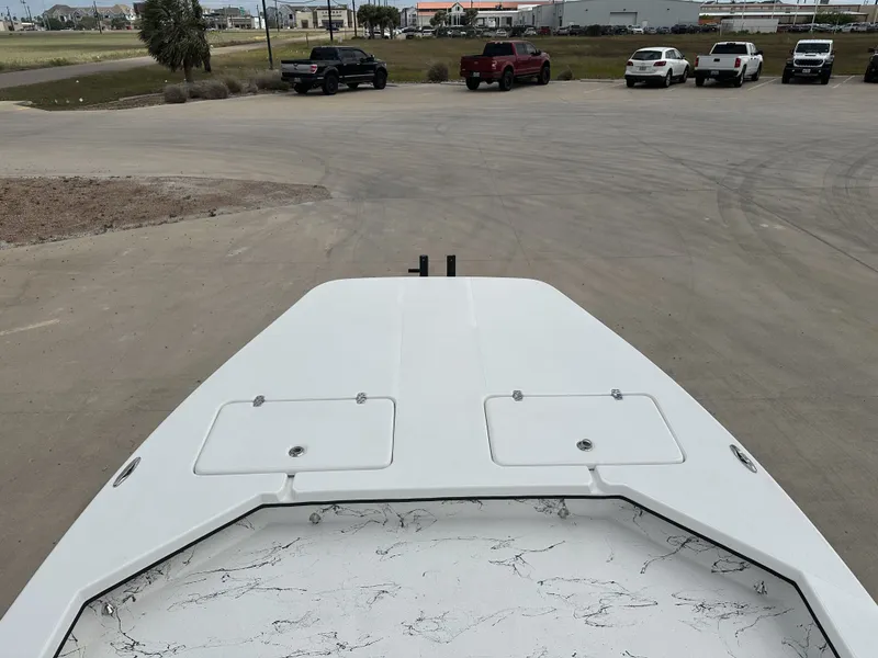 Slide: The Image of Front view of a 2026 Shoalwater 23' Catamaran on a parking lot. - 21