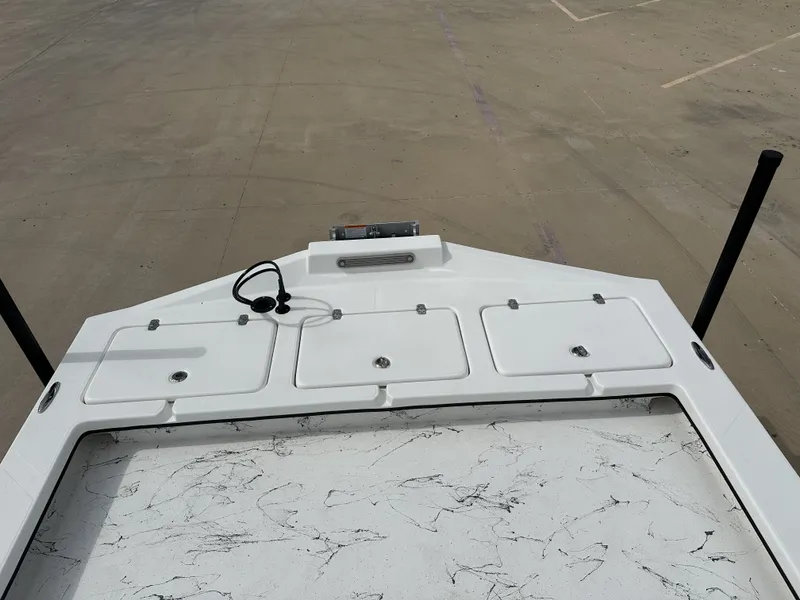 Slide: The Image of Deck of a 2026 Shoalwater 23' Catamaran with storage compartments. - 22