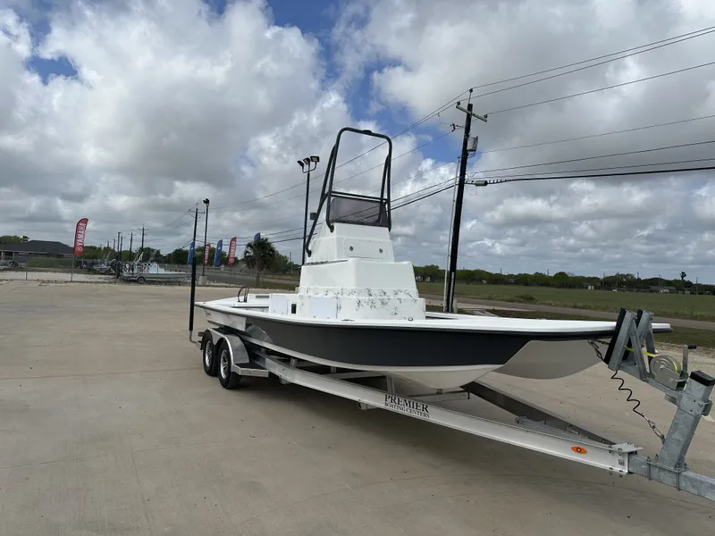 Slide: The Image of 2026 Shoalwater 23' Catamaran on trailer under cloudy sky. - 7