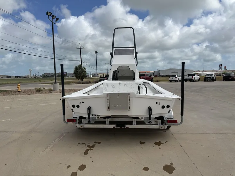 Slide: The Image of Rear view of a 2026 Shoalwater 23' Catamaran on a parking lot. - 8