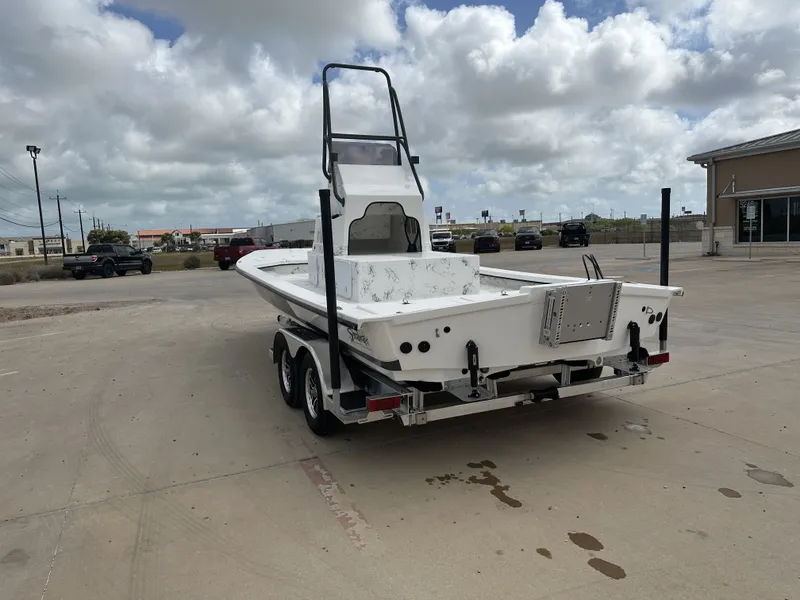Slide: The Image of 2026 Shoalwater 23' Catamaran parked outdoors on a trailer. - 9