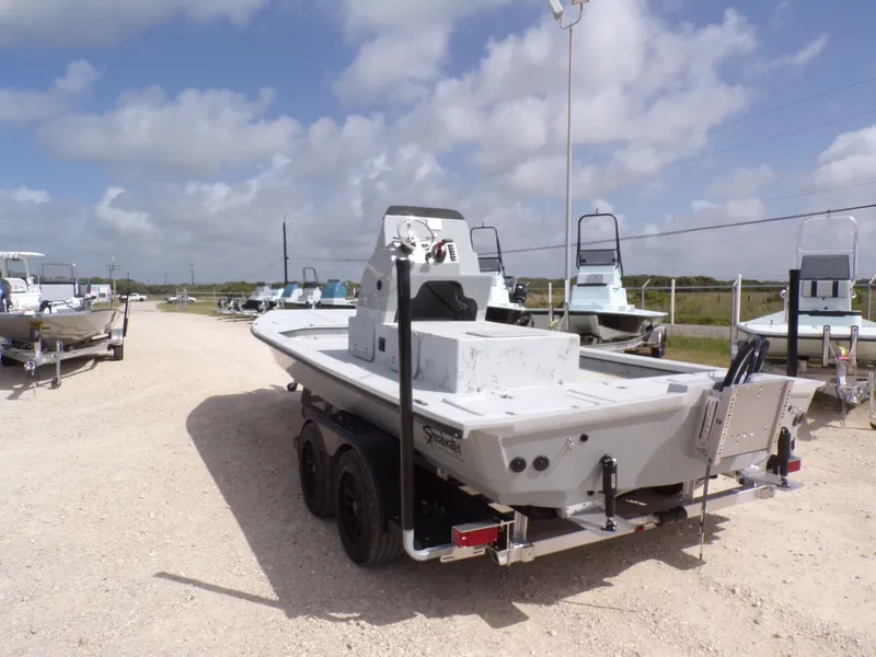 Slide: The Image of 2026 Shoalwater 23' Catamaran on trailer under sunny skies. - 11