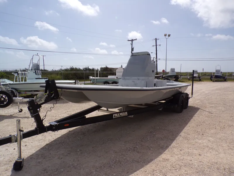Slide: The Image of 2026 Shoalwater 23' Catamaran on trailer outdoors. - 3