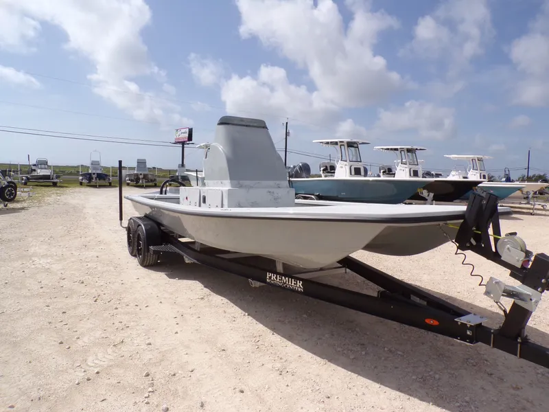 Slide: The Image of 2026 Shoalwater 23' Catamaran on trailer under sunny skies. - 7