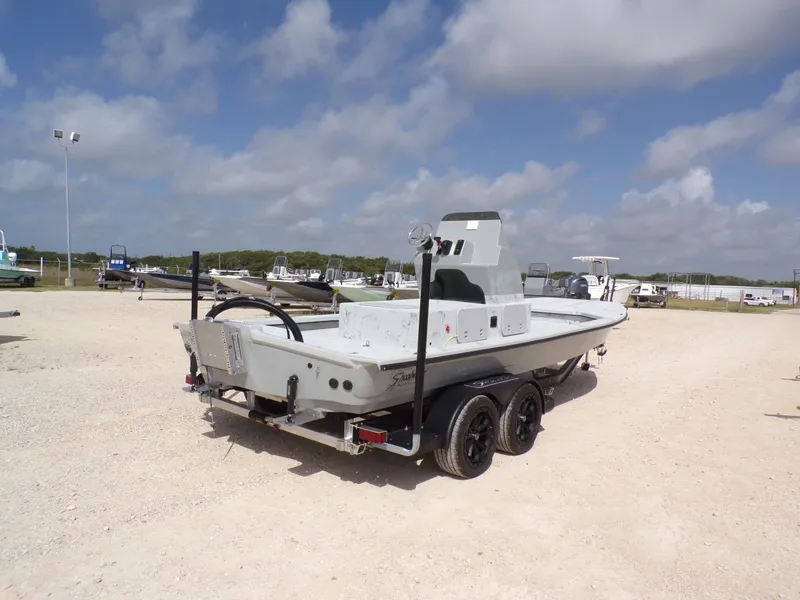 Slide: The Image of 2026 Shoalwater 23' Catamaran on trailer under blue sky. - 9