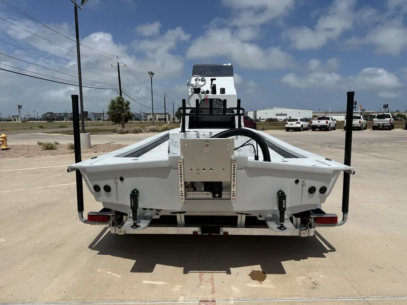 Slide: The Image of 2026 Shoalwater 23' Catamaran on a parking lot under sunny skies. - 10