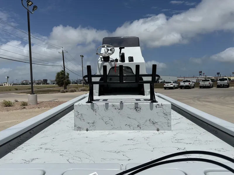 Slide: The Image of 2026 Shoalwater 23' Catamaran on parking lot under sunny skies. - 16