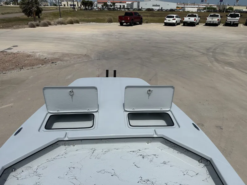 Slide: The Image of 2026 Shoalwater 23' Catamaran with open storage compartments on deck. - 18