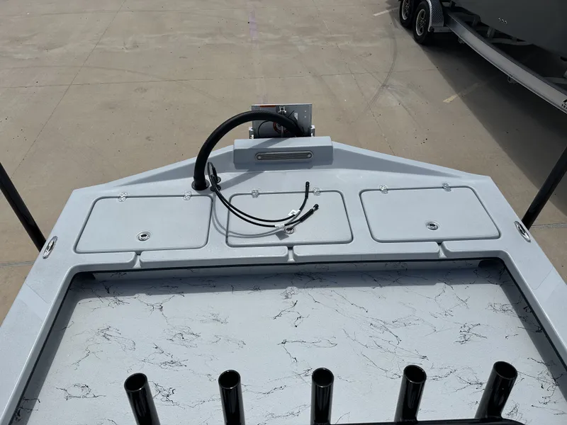 Slide: The Image of Deck of a 2026 Shoalwater 23' Catamaran with storage compartments. - 20