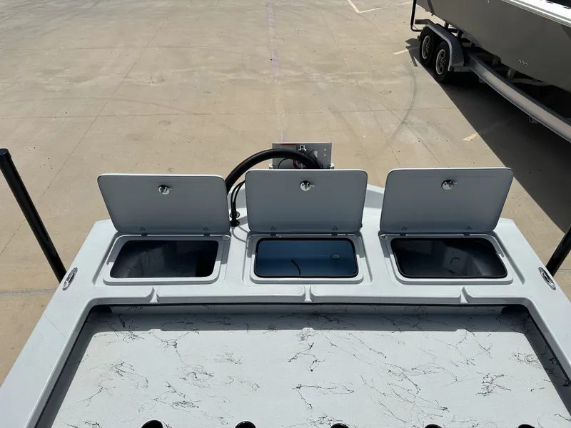 Slide: The Image of 2026 Shoalwater 23' Catamaran with three open storage compartments. - 21