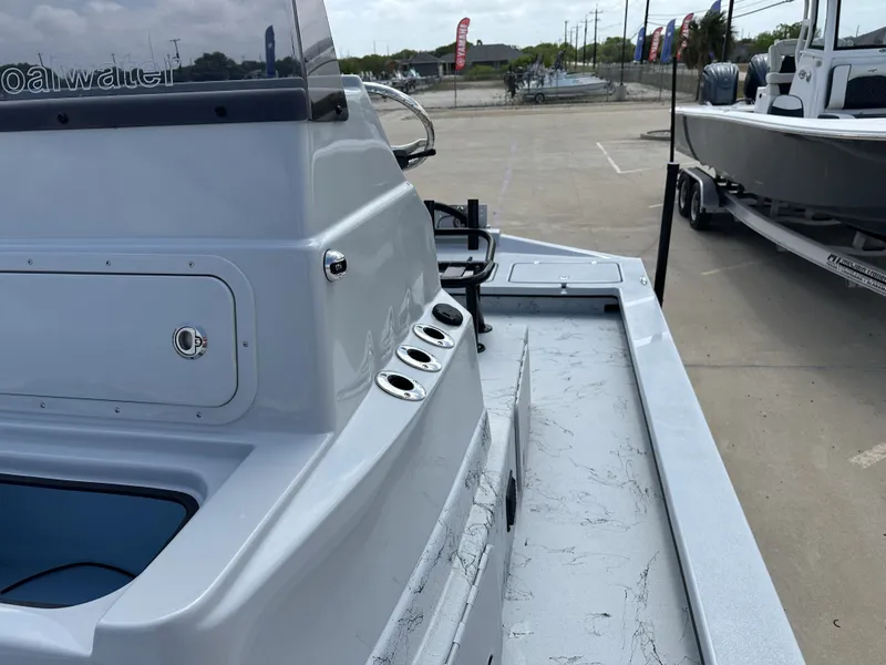 Slide: The Image of 2026 Shoalwater 23' Catamaran on a parking lot. - 22