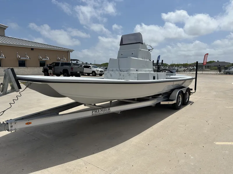 Slide: The Image of 2026 Shoalwater 23' Catamaran on trailer outdoors. - 3