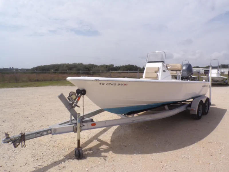 The Image of 2016 Sportsman 207 Masters boat on trailer outdoors. - 1